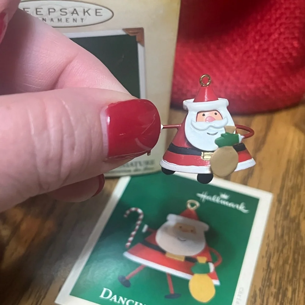 Hallmark Dancing Santa Ornament with Red and Green accents.